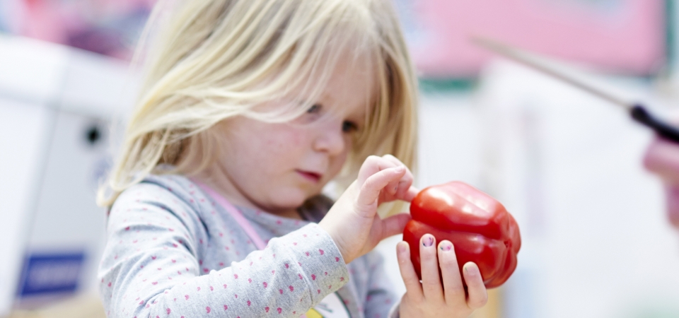 Little girl with pepper