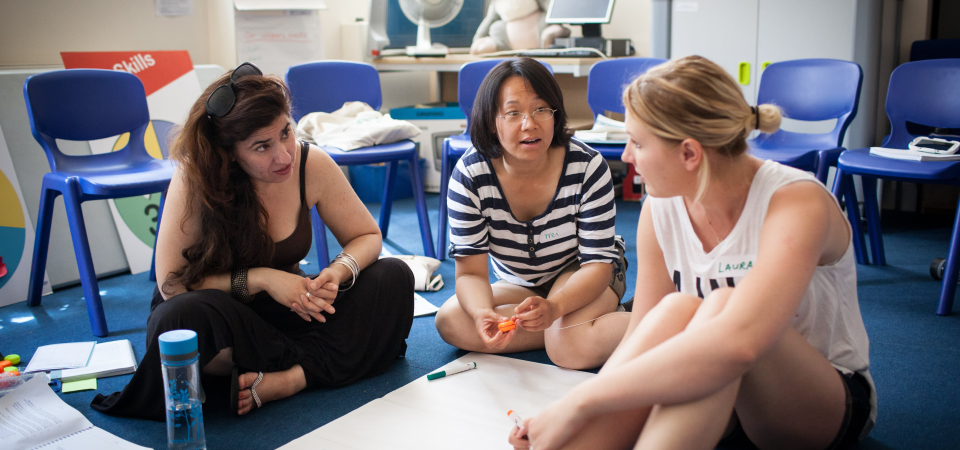 three women in a circle part of a training