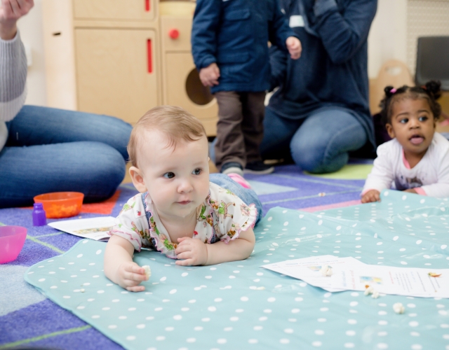 Children crawling at a HENRY group programme (feature)