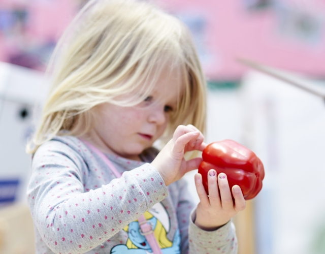 Little girl with pepper