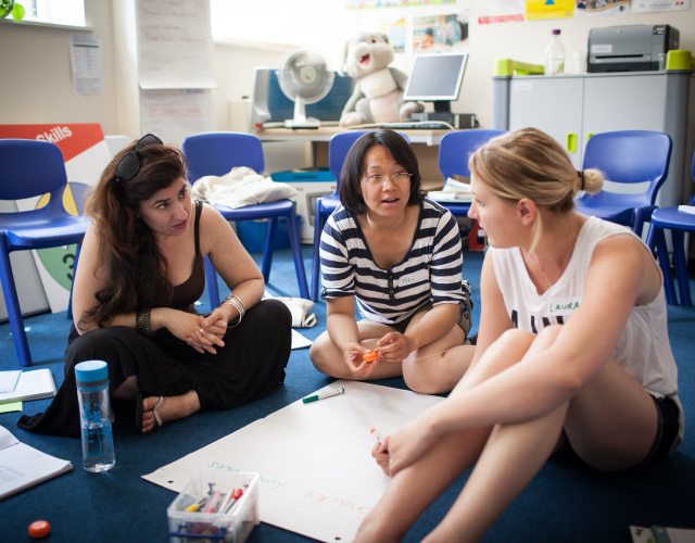 three women in a circle part of a training