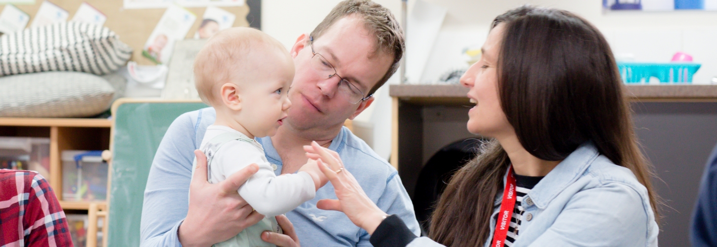 Baby, dad and facilitator at a HENRY group programme