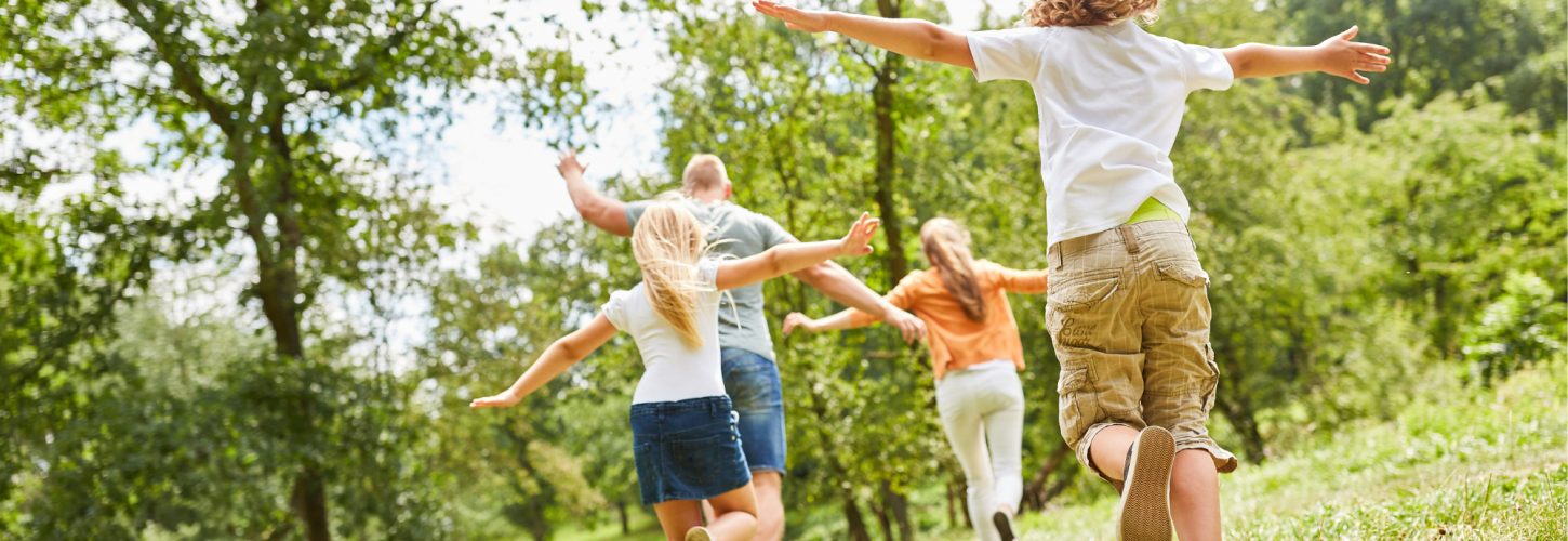 Family playing in a park
