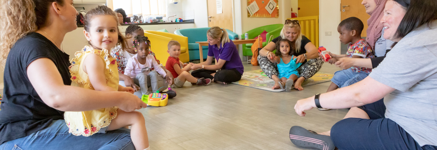 group of mums and children sitting in a circle
