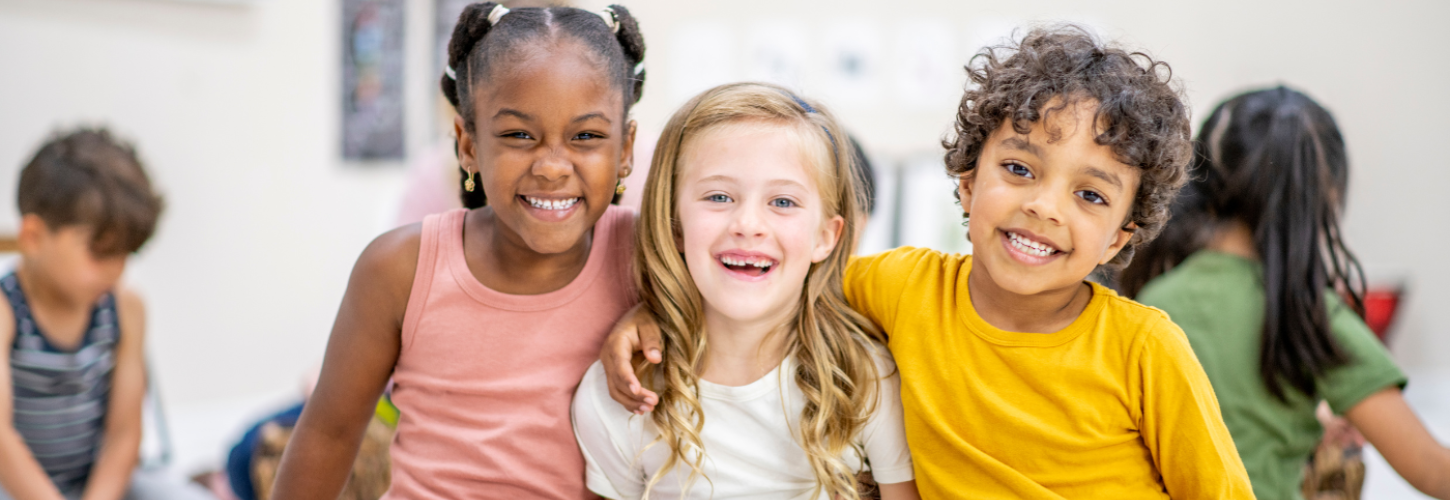 3 children sitting next to each other