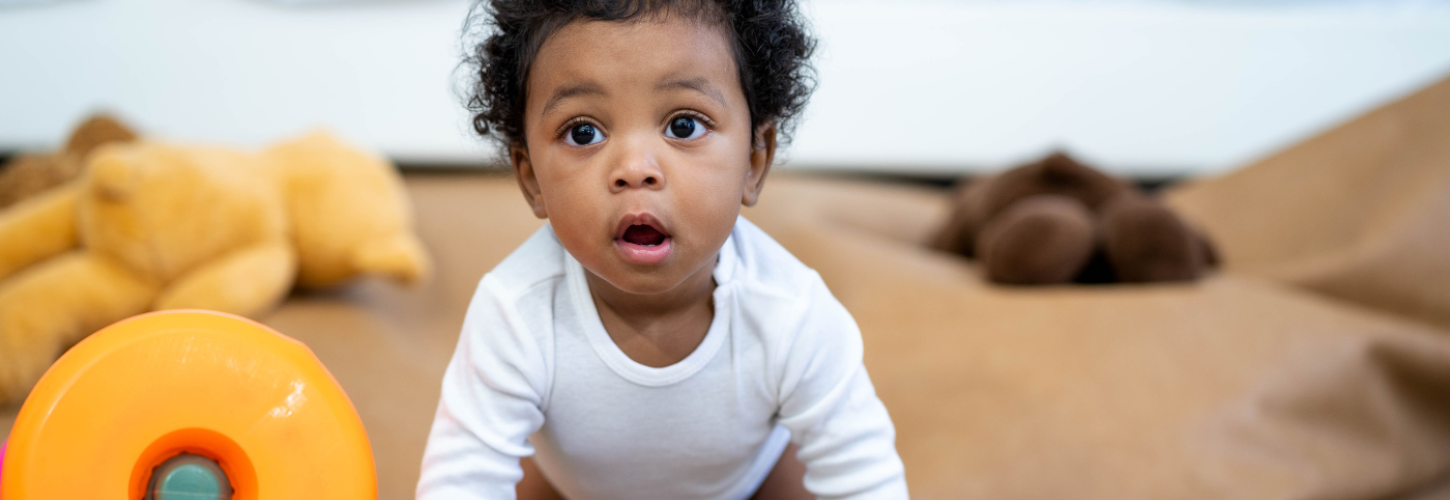 young coloured baby crawling