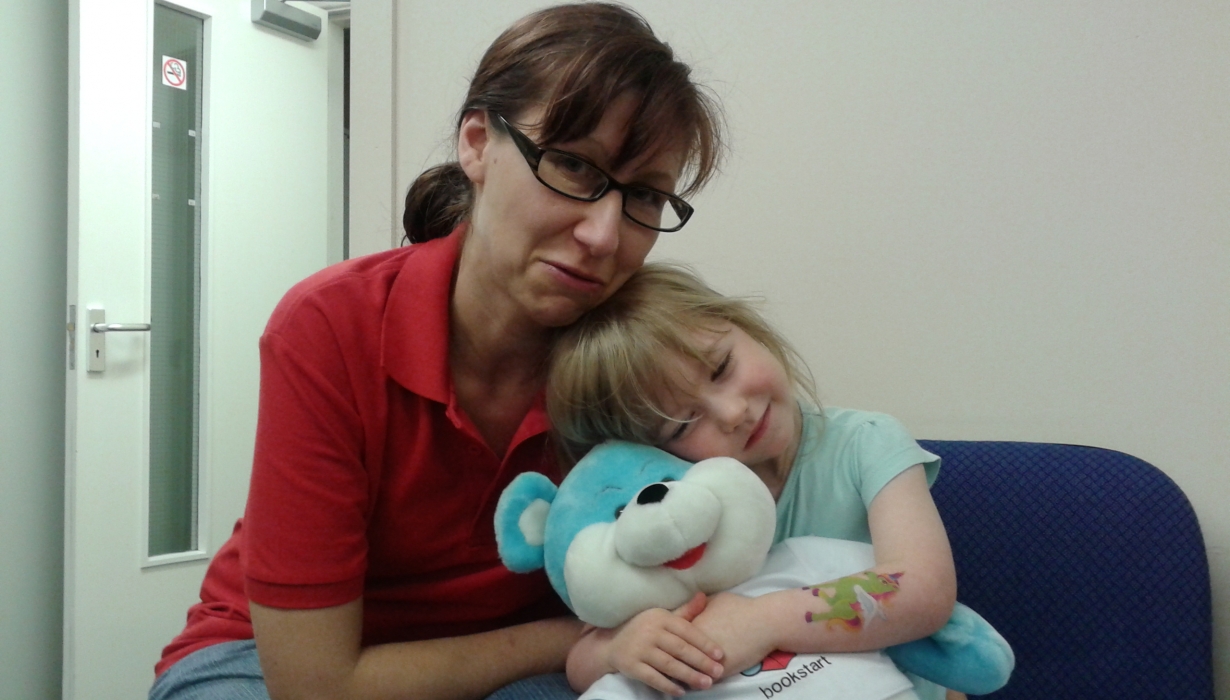 Amanda and daughter with teddy bear