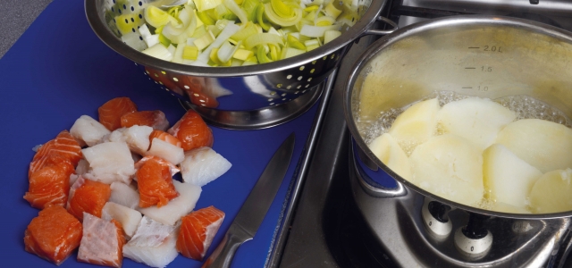 boiling potatoes and prepared fish and vegetables