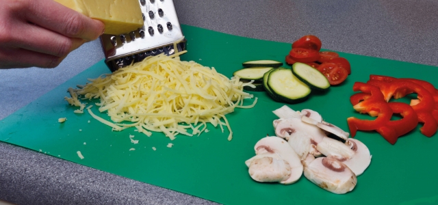 grated cheese and prepared vegetables