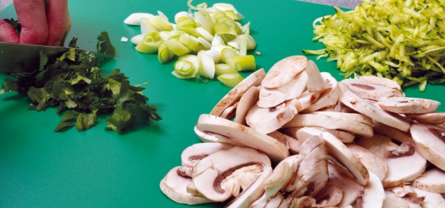 chopping mushrooms and vegetables